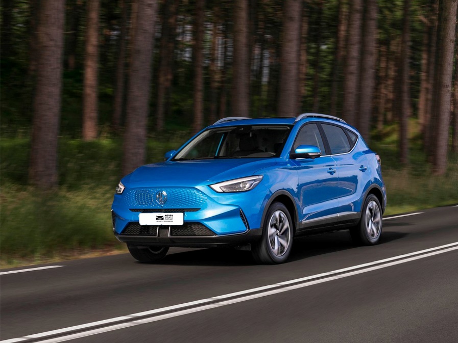 A blue car on a road

Description automatically generated